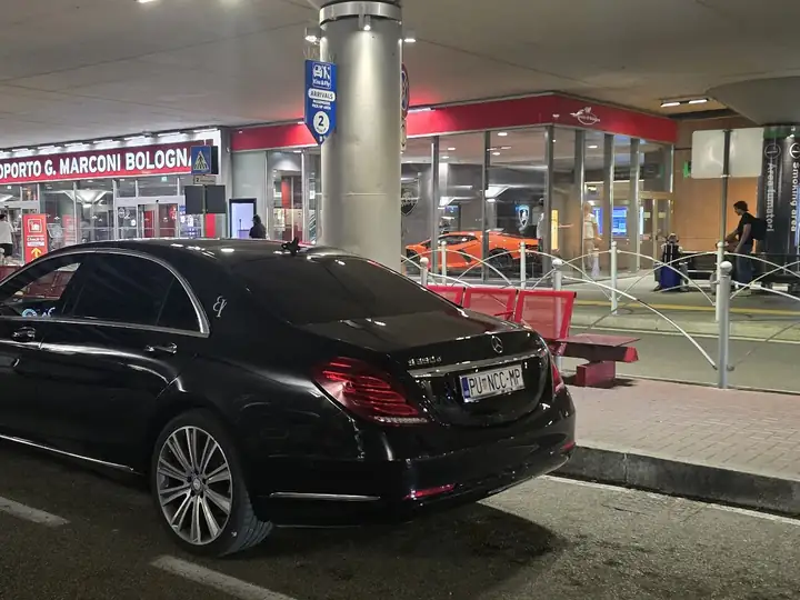 Mercedes S-Class of Taxi Transfers Umag parked in front of an airport terminal