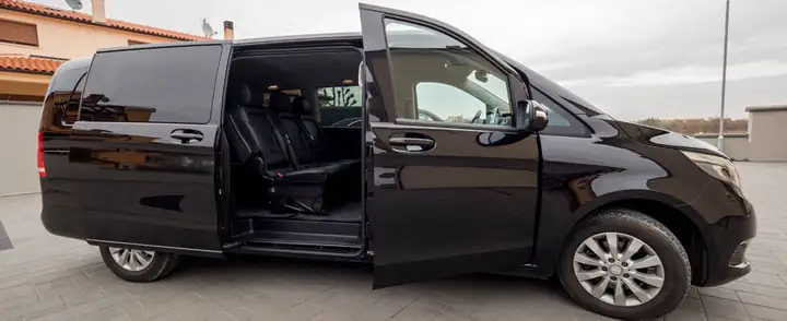 Mercedes V-Class with the sliding door open, leather seats inside